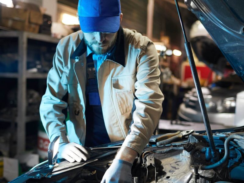 repairman-fixing-engine-detail-1.jpg