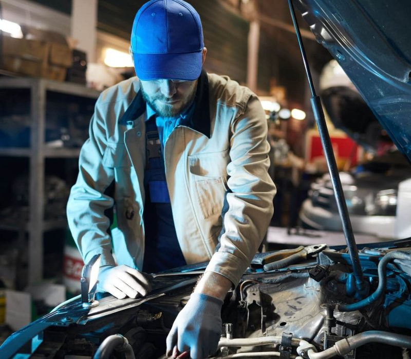 repairman-fixing-engine-detail-1.jpg